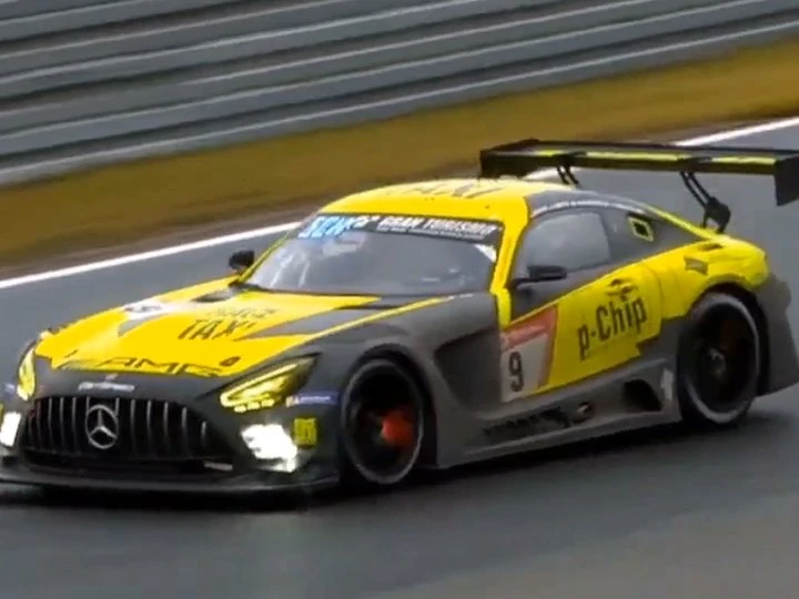 A p-Chip-branded race car on track.